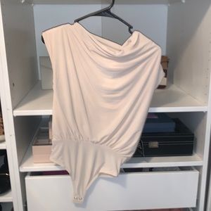 Cream bodysuit with padded shoulders